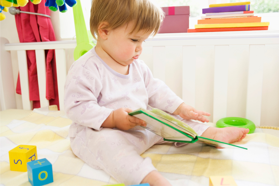 baby holding book